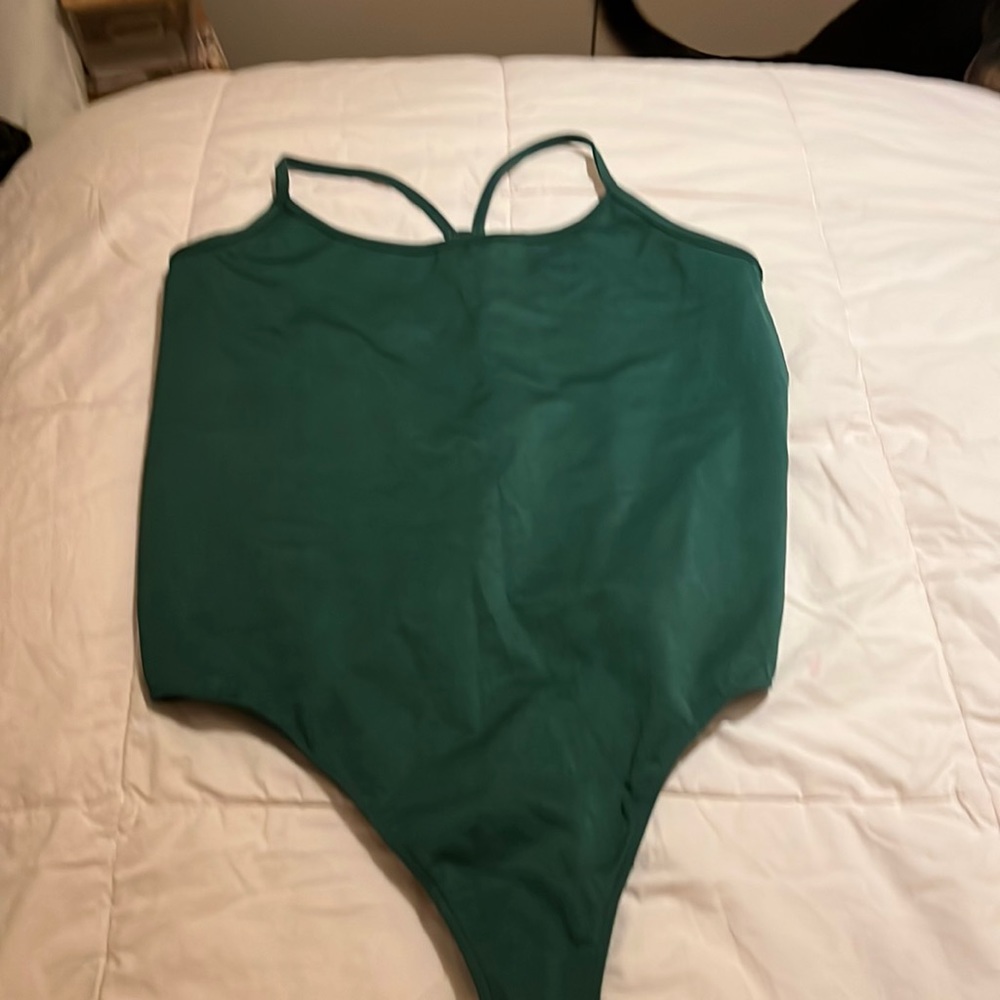 TNA thong bodysuit.  Forest green